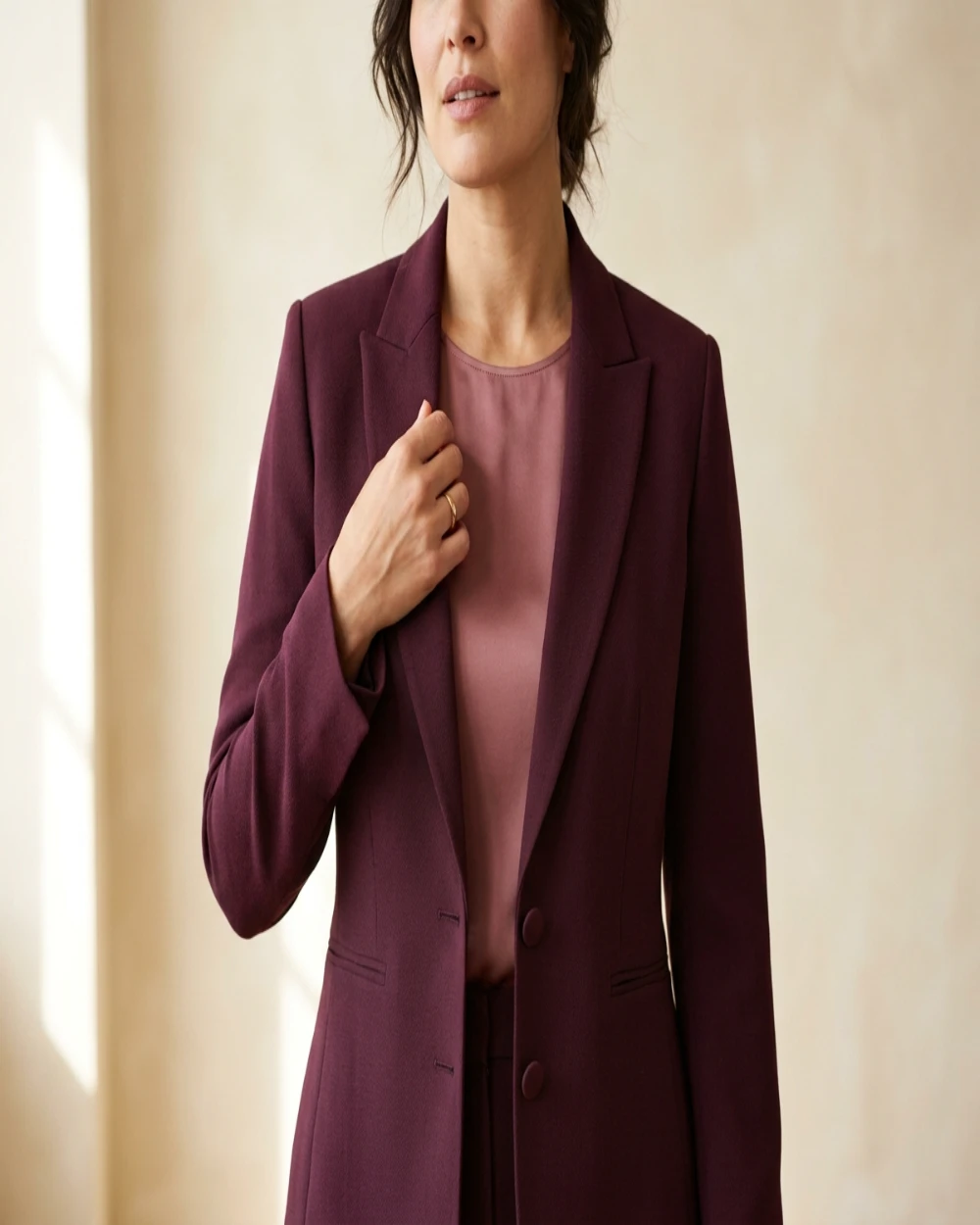  close-up editorial shot showing tailored fit detail at the bust]